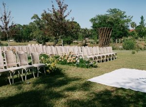 edding ceremony chairs and floral arrangements set in the NOMA Sculpture Garden in New Orleans.