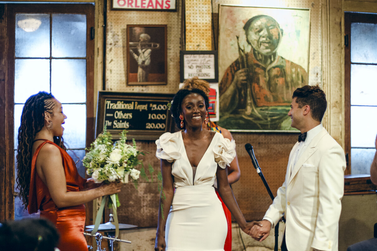 bride and groom holding hands during their wedding in New Orleans