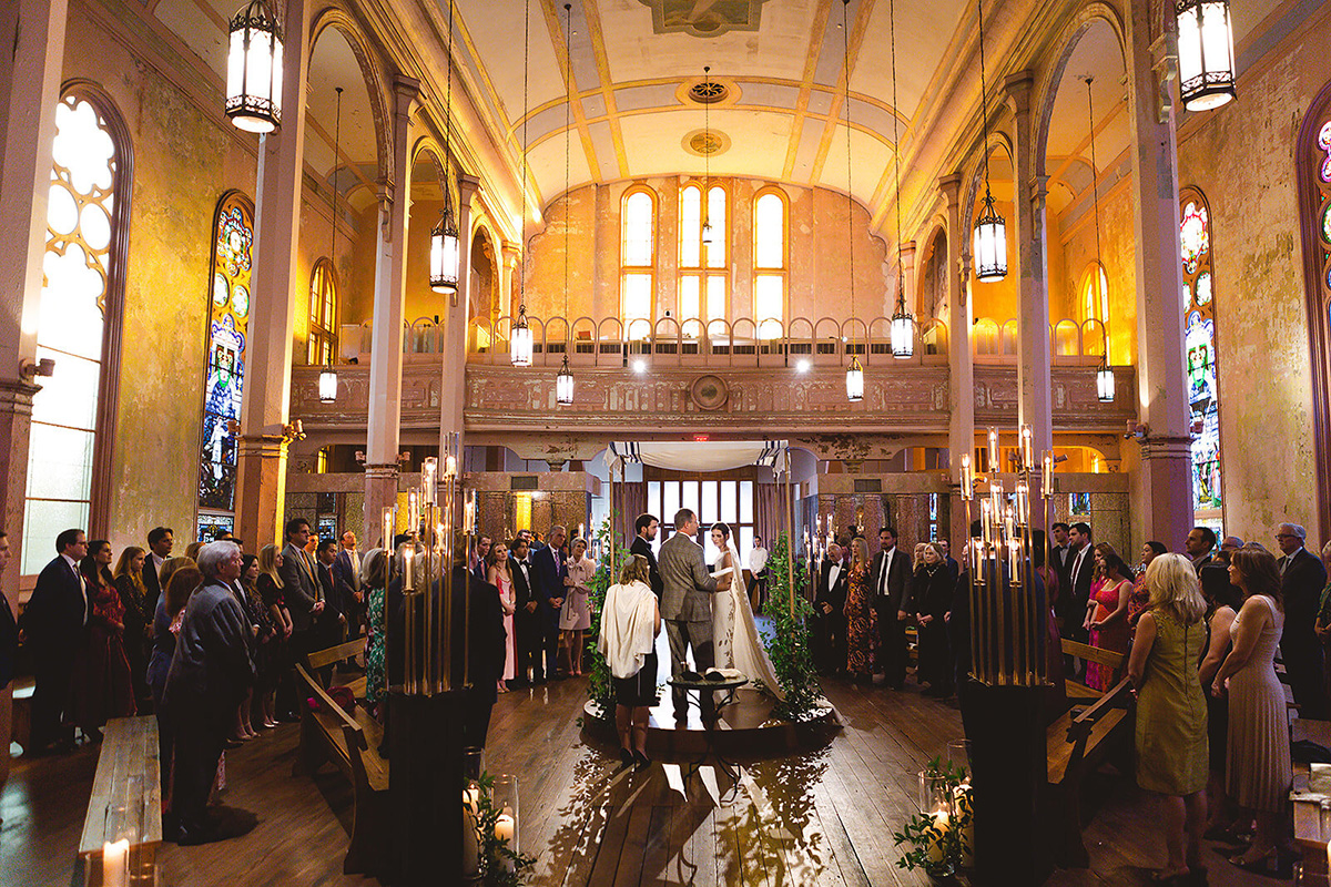 wedding ceremony taking place inside the former church at Hotel Peter and Paul in New Orleans